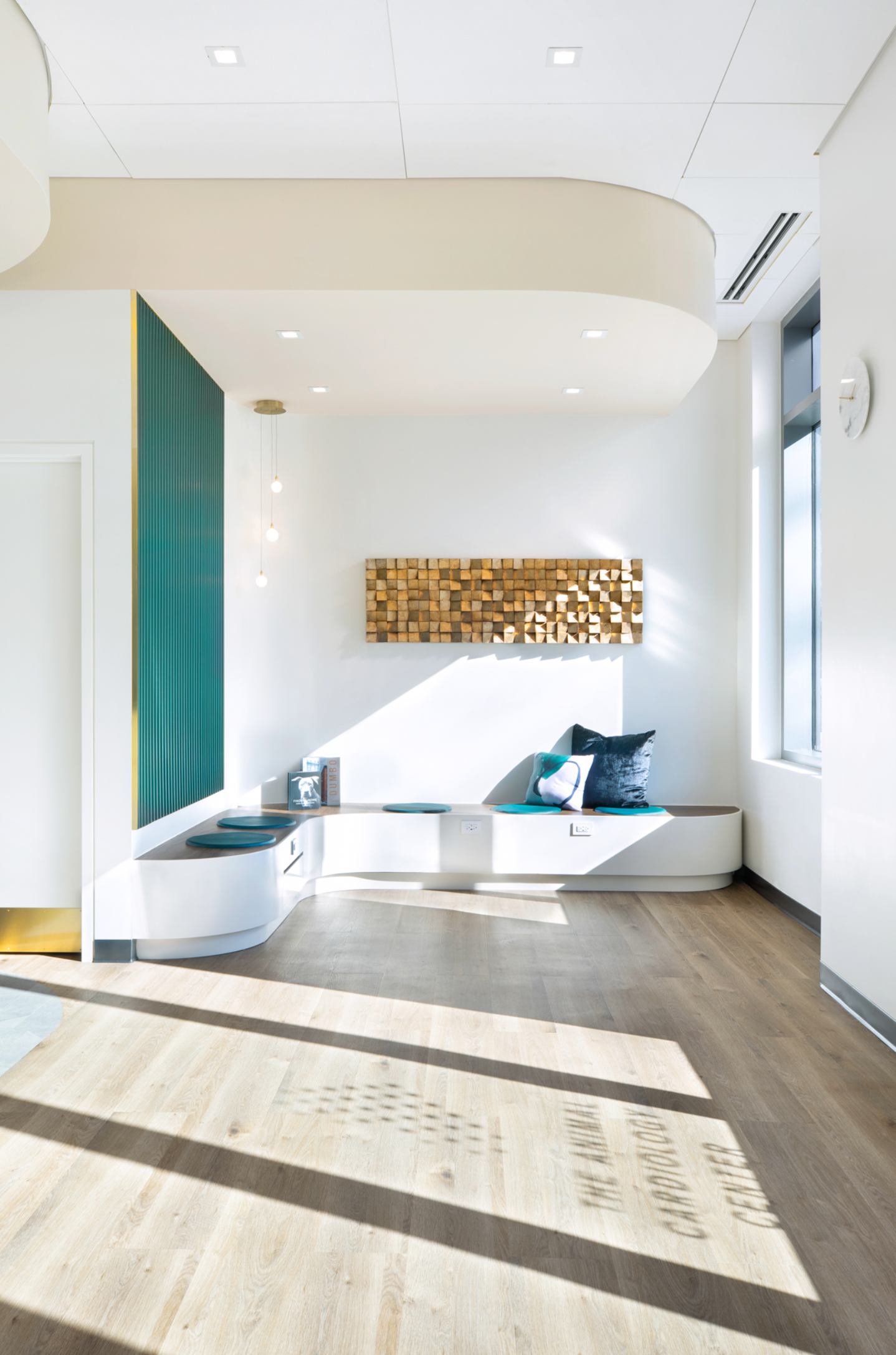 A living room with a couch and a window.