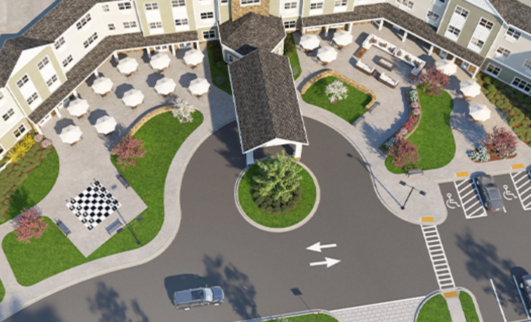 An aerial view of a large building with a lot of tables and chairs