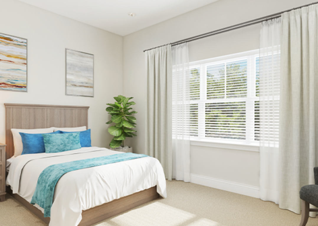 A bedroom with a bed and a window with blinds.