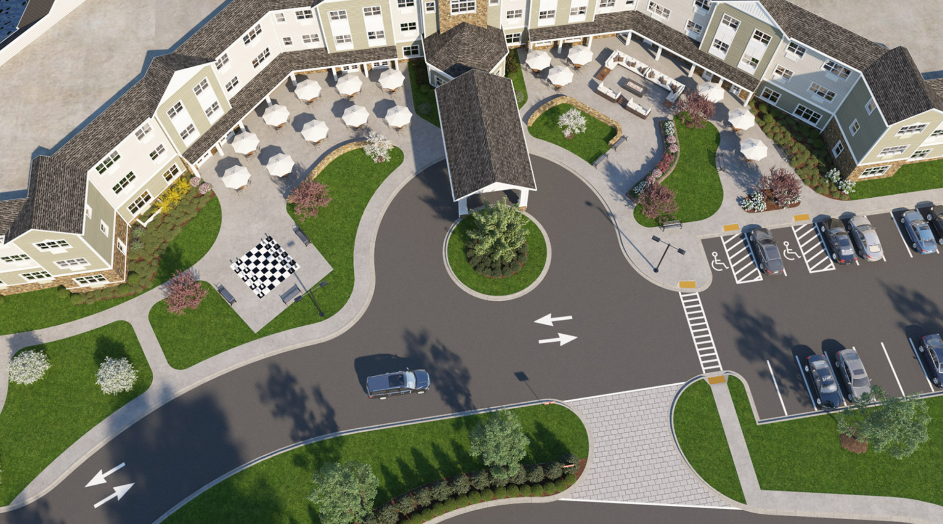 An aerial view of a large building with a parking lot in front of it