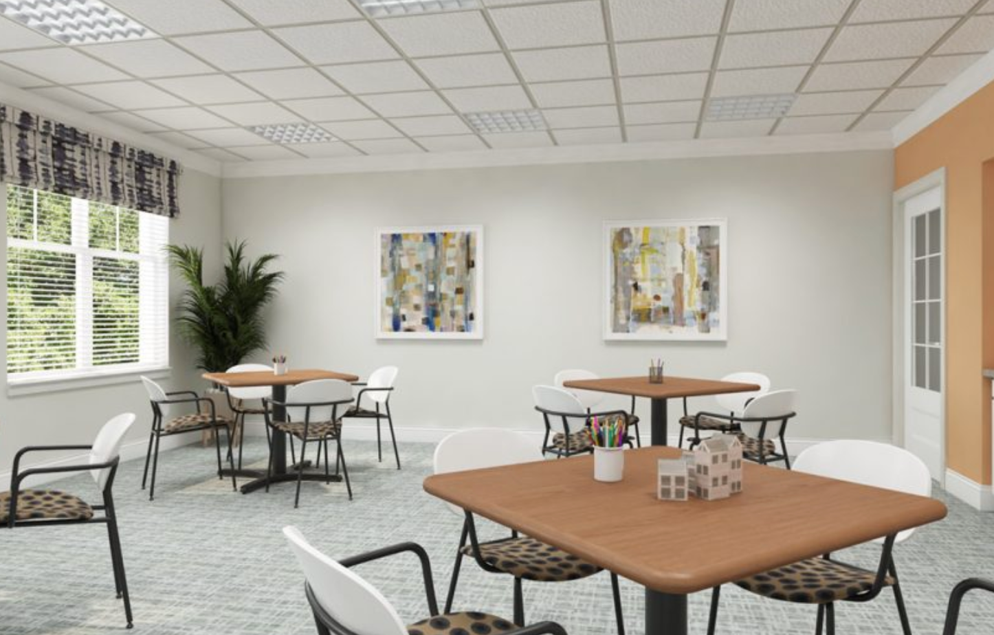 there are many tables and chairs in this room .