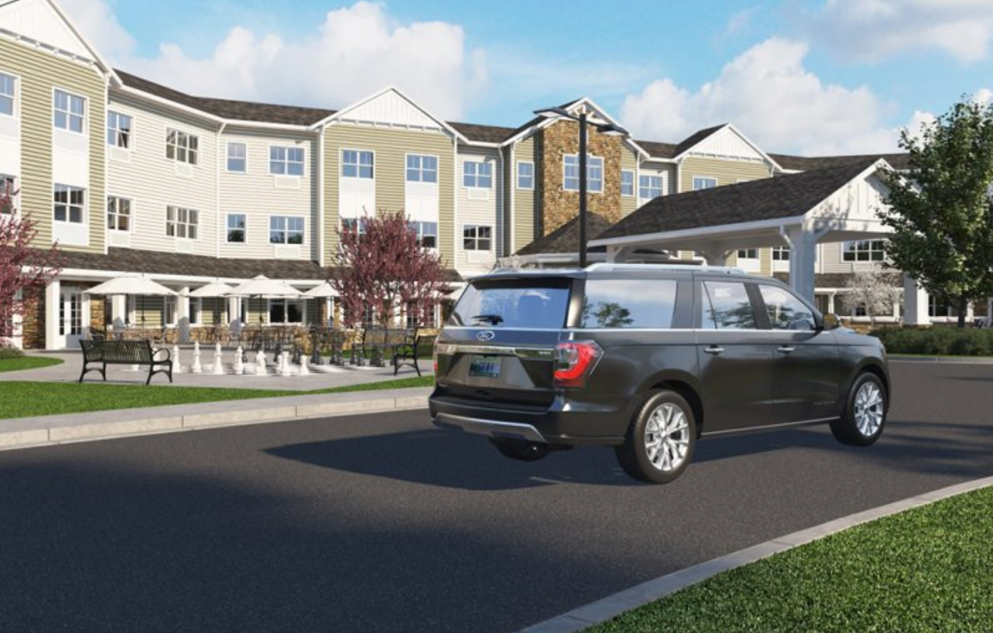 a car is driving down a street in front of a building .