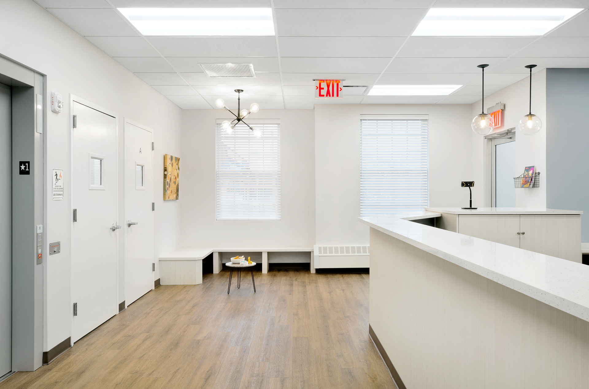 There is a red exit sign in the middle of the room.