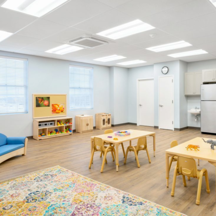 A large room with tables and chairs in it