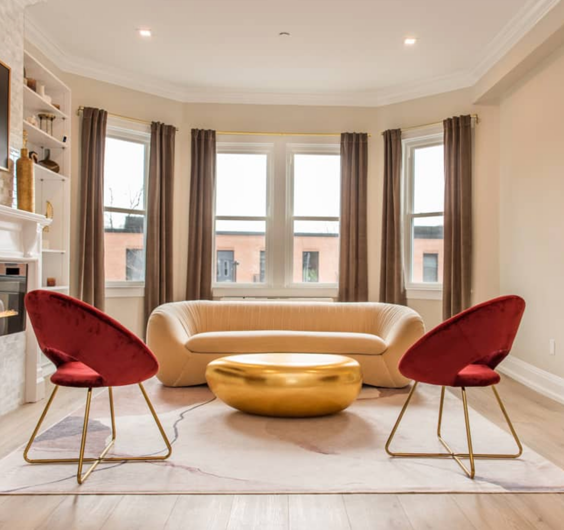 a living room with a couch and two chairs