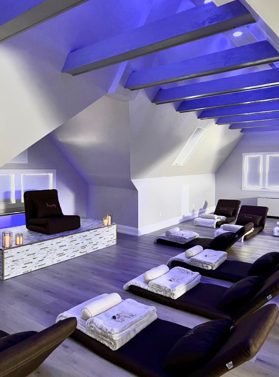 a room with a lot of chairs and candles in it