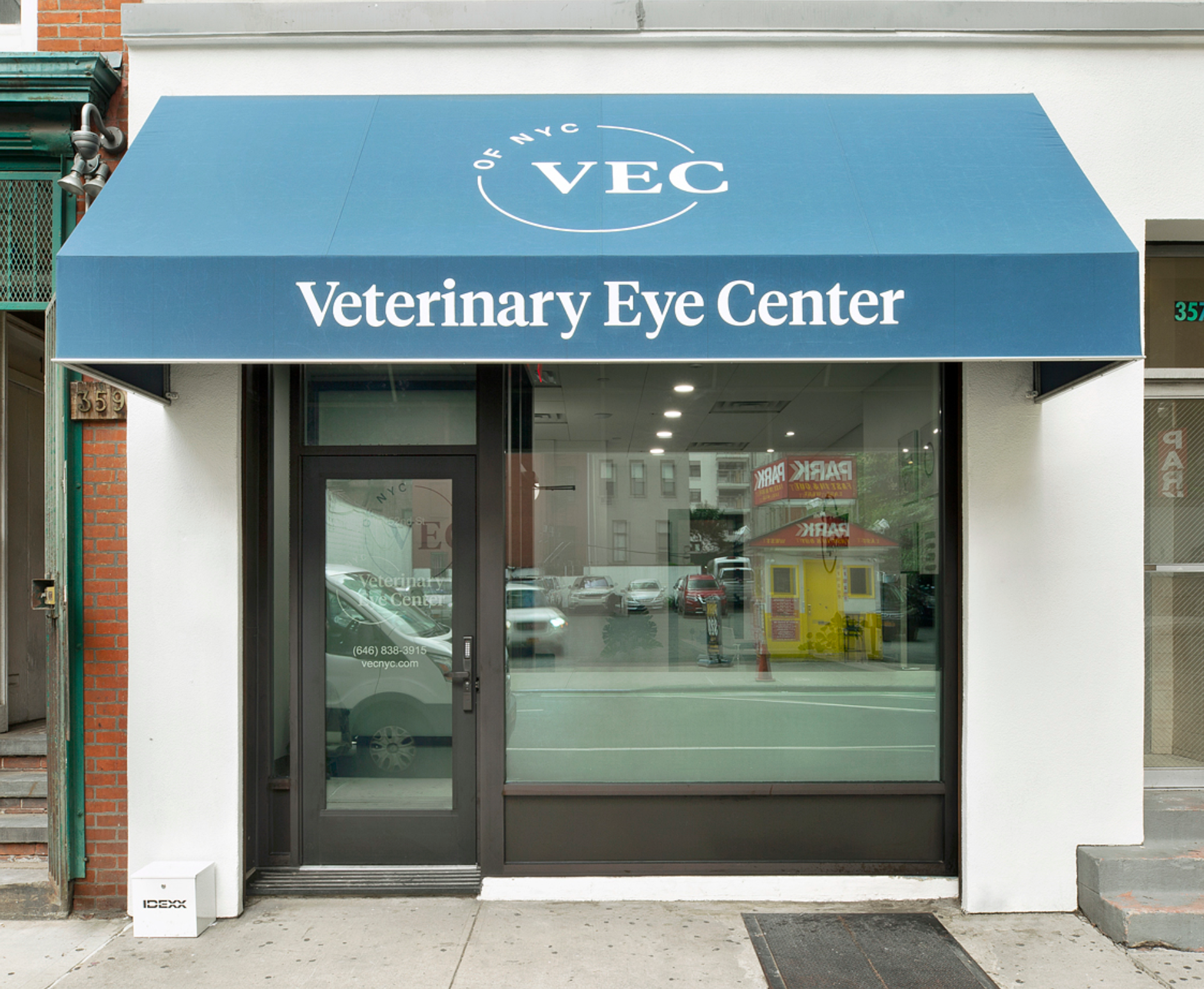A veterinary eye center with a blue awning