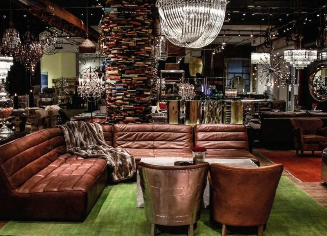 A living room filled with furniture and a large chandelier