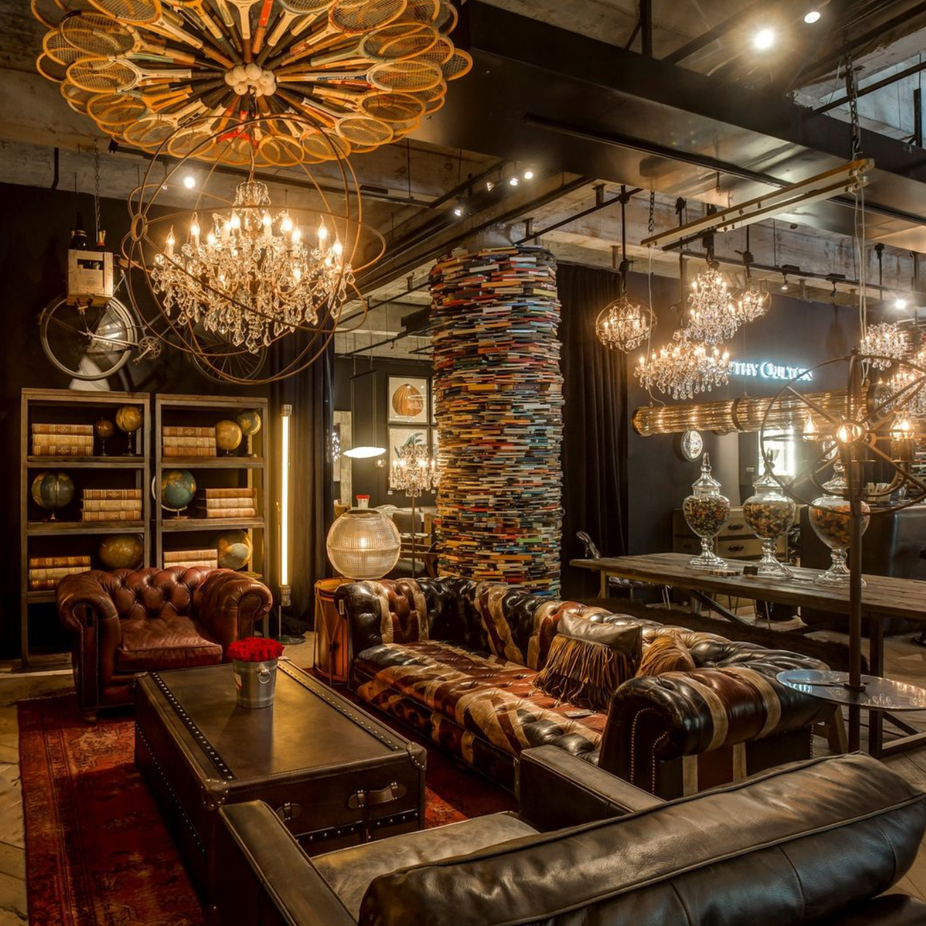 A living room with a lot of furniture and chandeliers