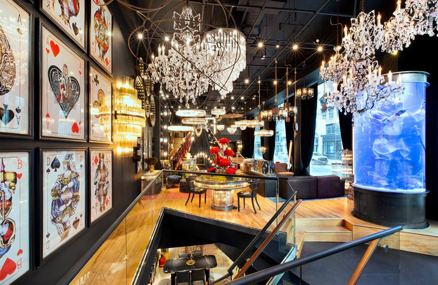 A room with a lot of chandeliers and playing cards on the wall