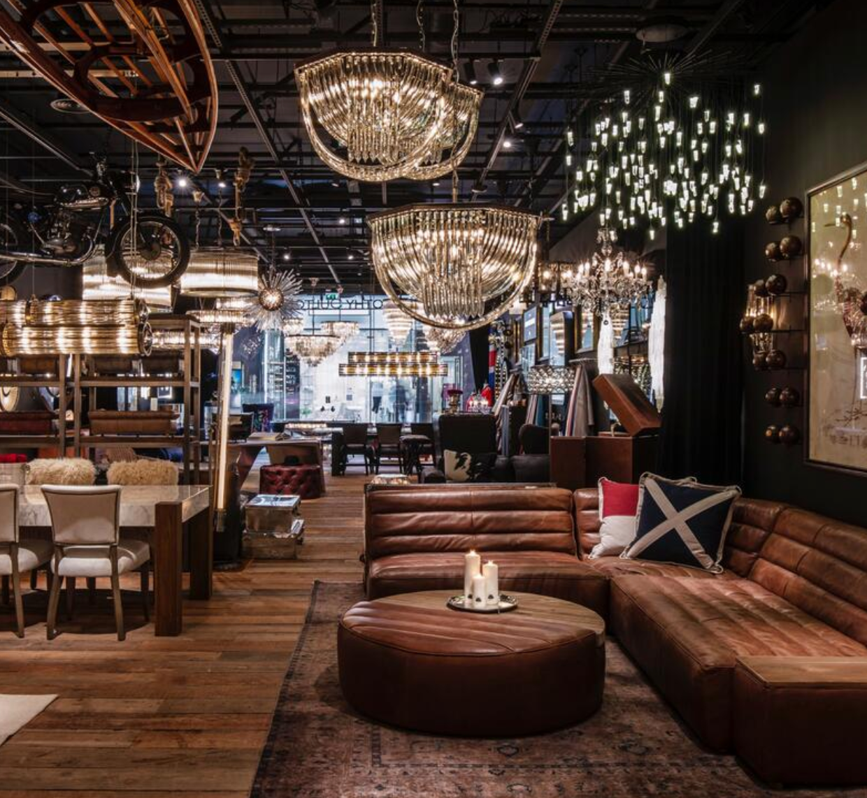 A living room with a lot of furniture and chandeliers