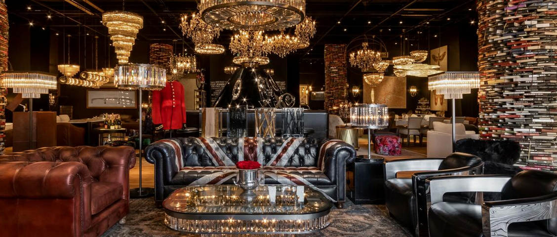 A living room filled with furniture and a chandelier.