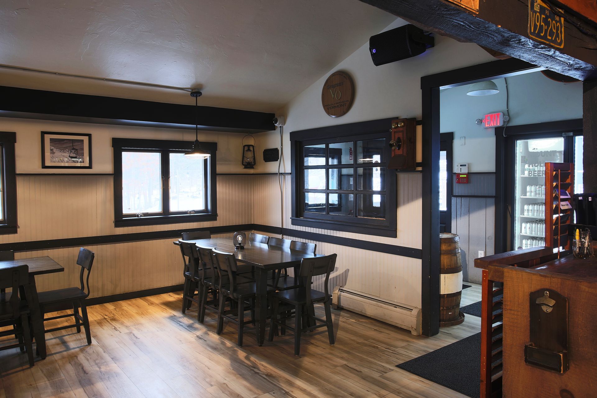 A restaurant with tables and chairs and a bar