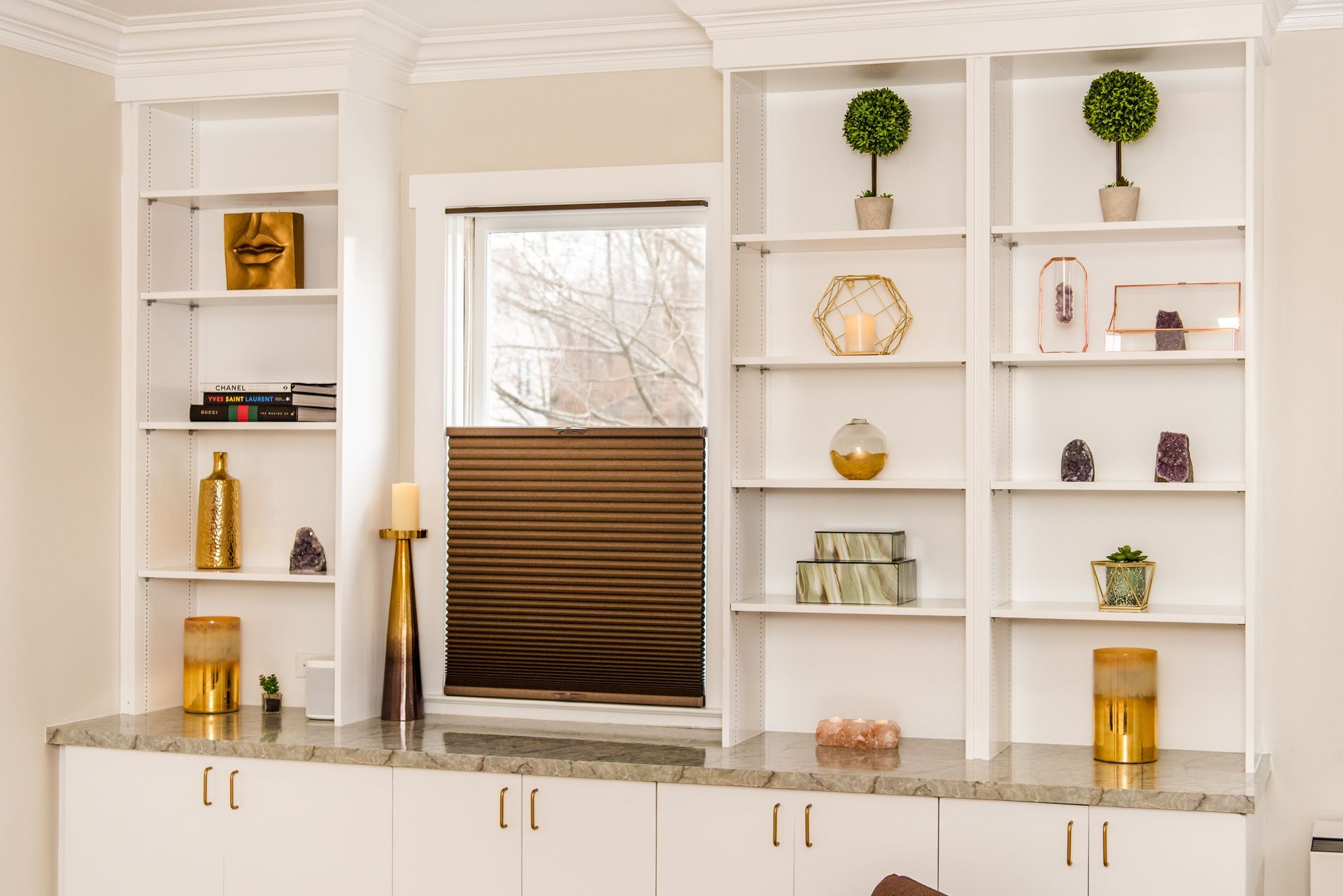 a room with a lot of shelves and a window