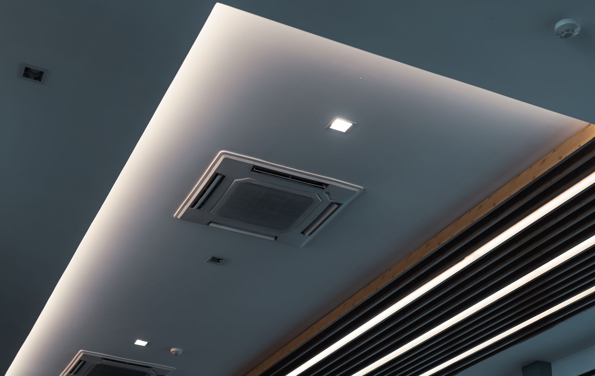 A ceiling with a fan and lights on it