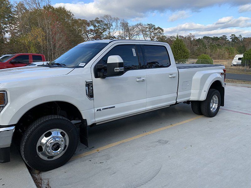 white pickup truck with tinted windows