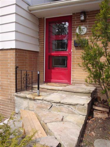 before existing stone steps to front door