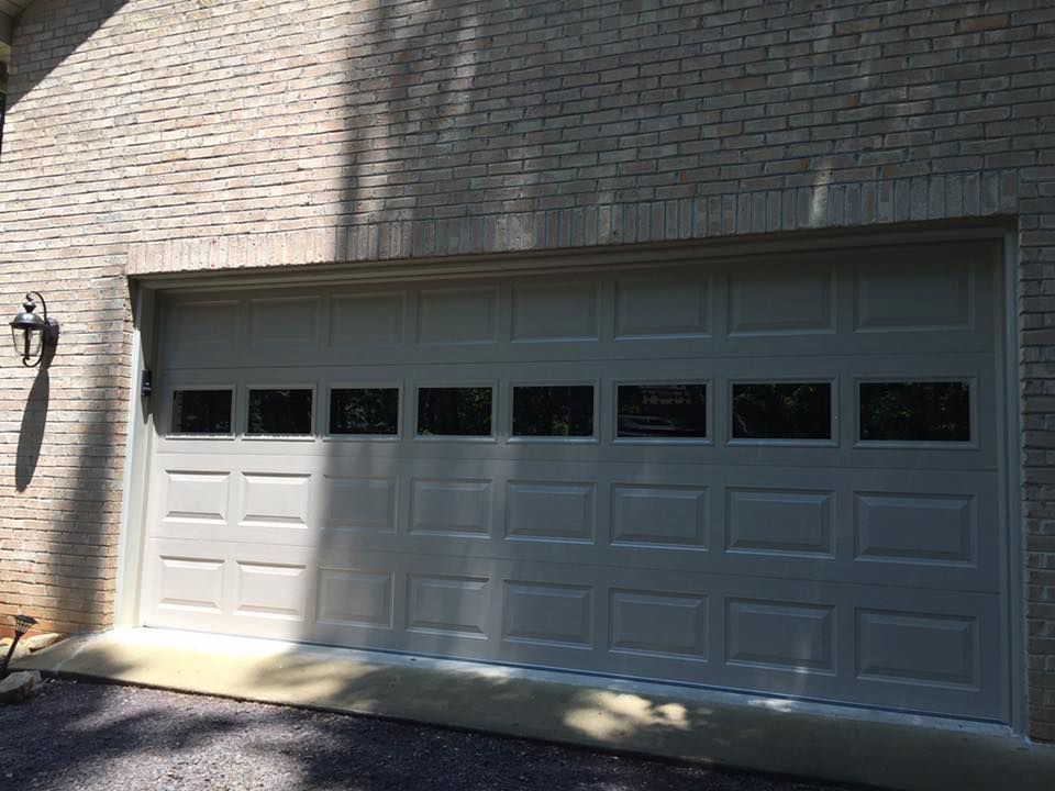 Before White Garage Door is Open on a Brick — Culpeper, VA — Quality Garage Doors VA