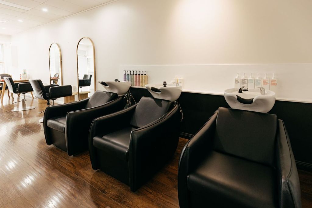 Woman getting hair was h at basins by A Woman  — L.A Hair Design Ballina In Ballina NSW, 2478