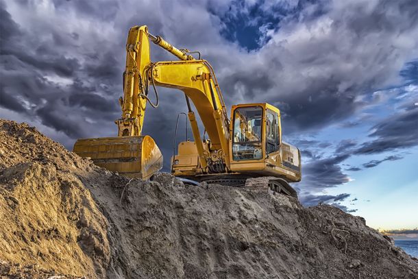 Stopping Yellow Excavator — New Iberia, LA — Iberia Rental