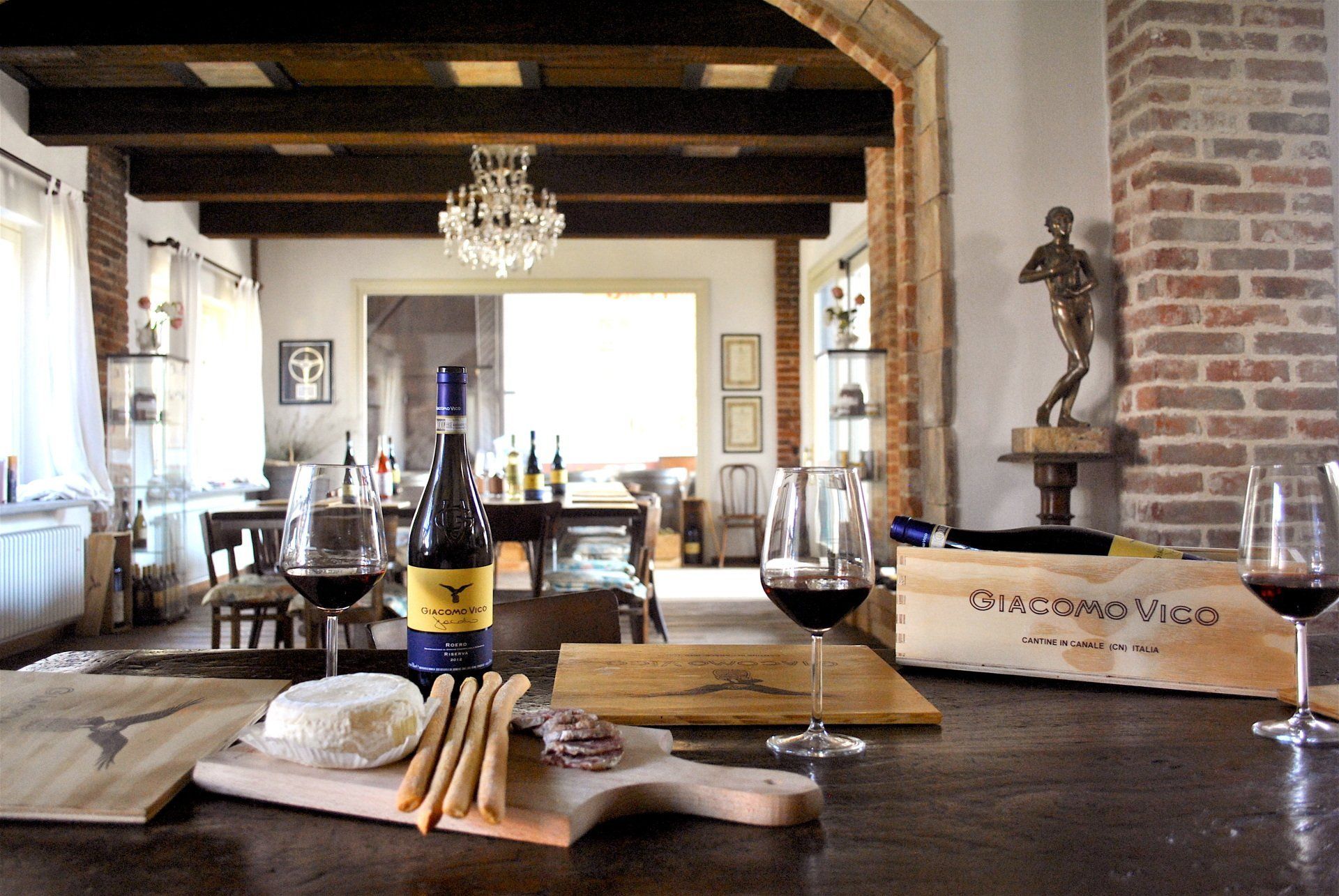 wine tasting area with sausage, cheese and breadsticks