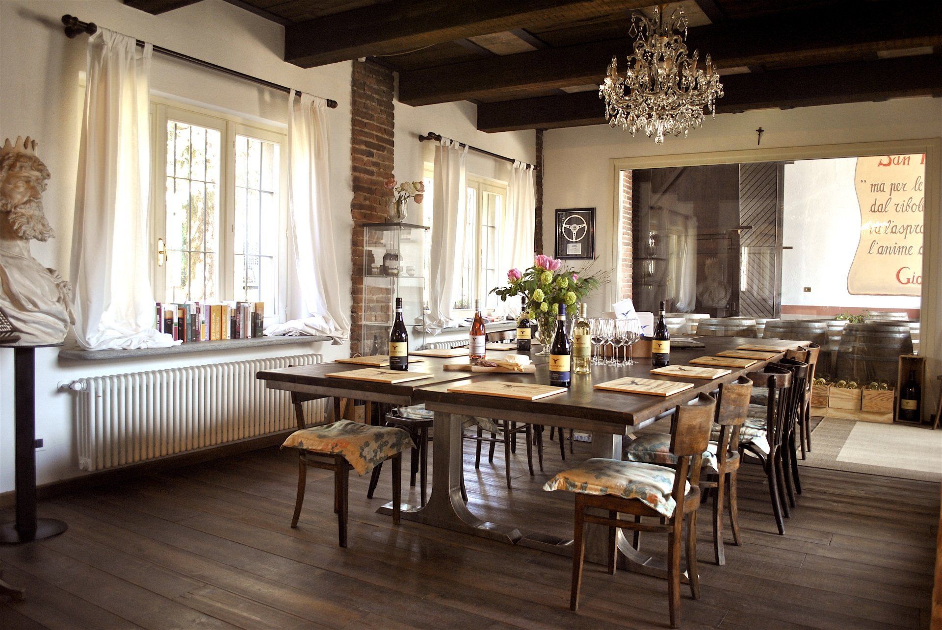 wine tasting area with wooden table and chairs