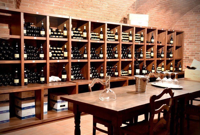wine cellar with bottles on shelves