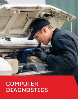 A man is working under the hood of a car with the words computer diagnostics below him 2 | D&W Auto Repair