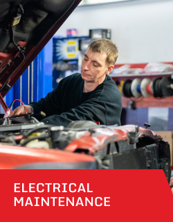 A man is working on an electrical system of a car | D&W Auto Repair