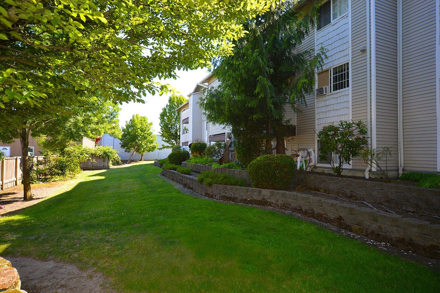 Exterior view grass area adjacent to apartments