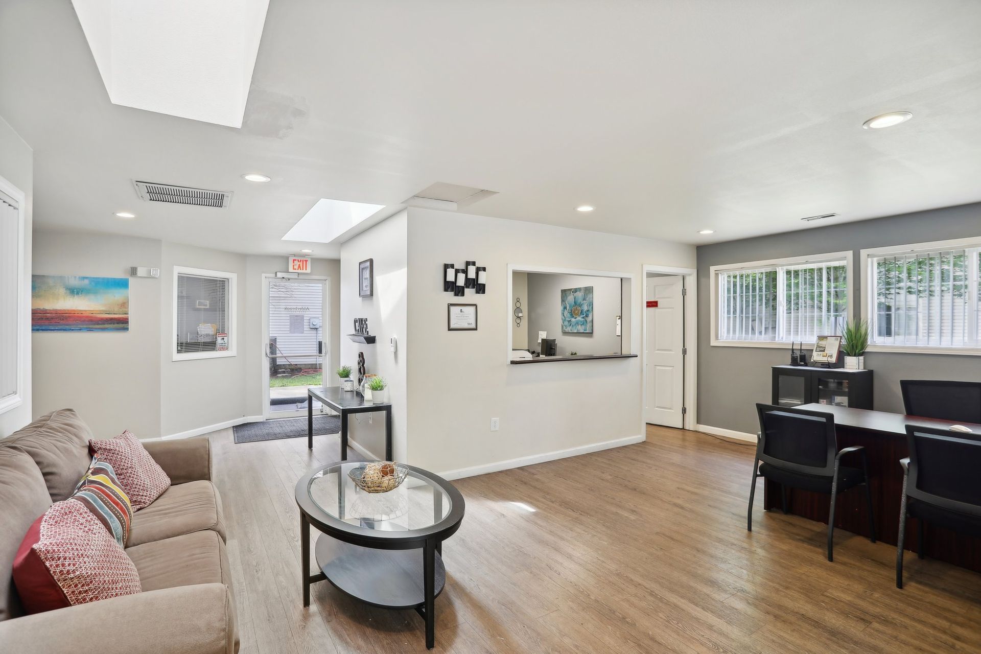 Interior view of sofa, coffee table and plant in the corner