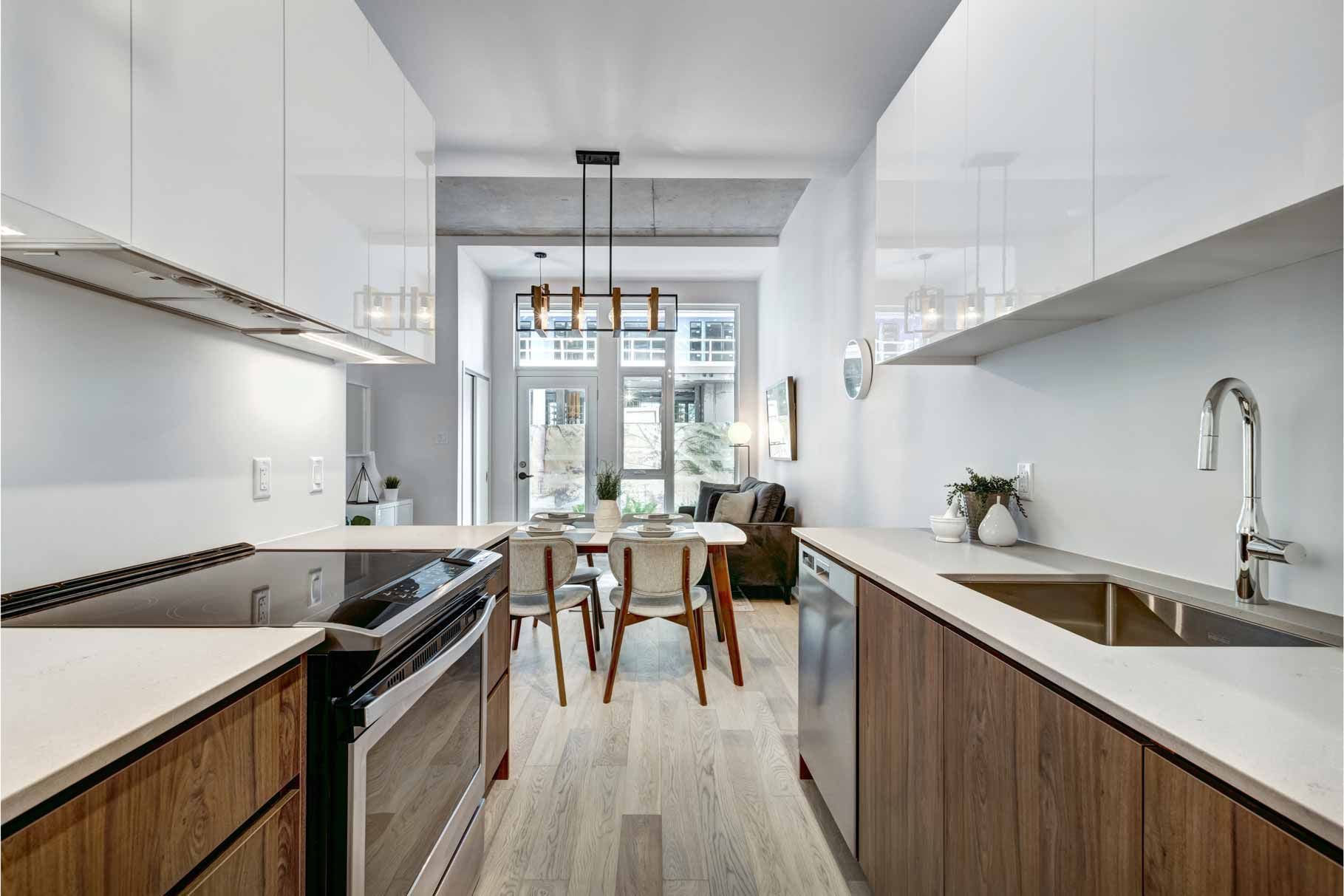 A kitchen with stainless steel appliances and wooden cabinets