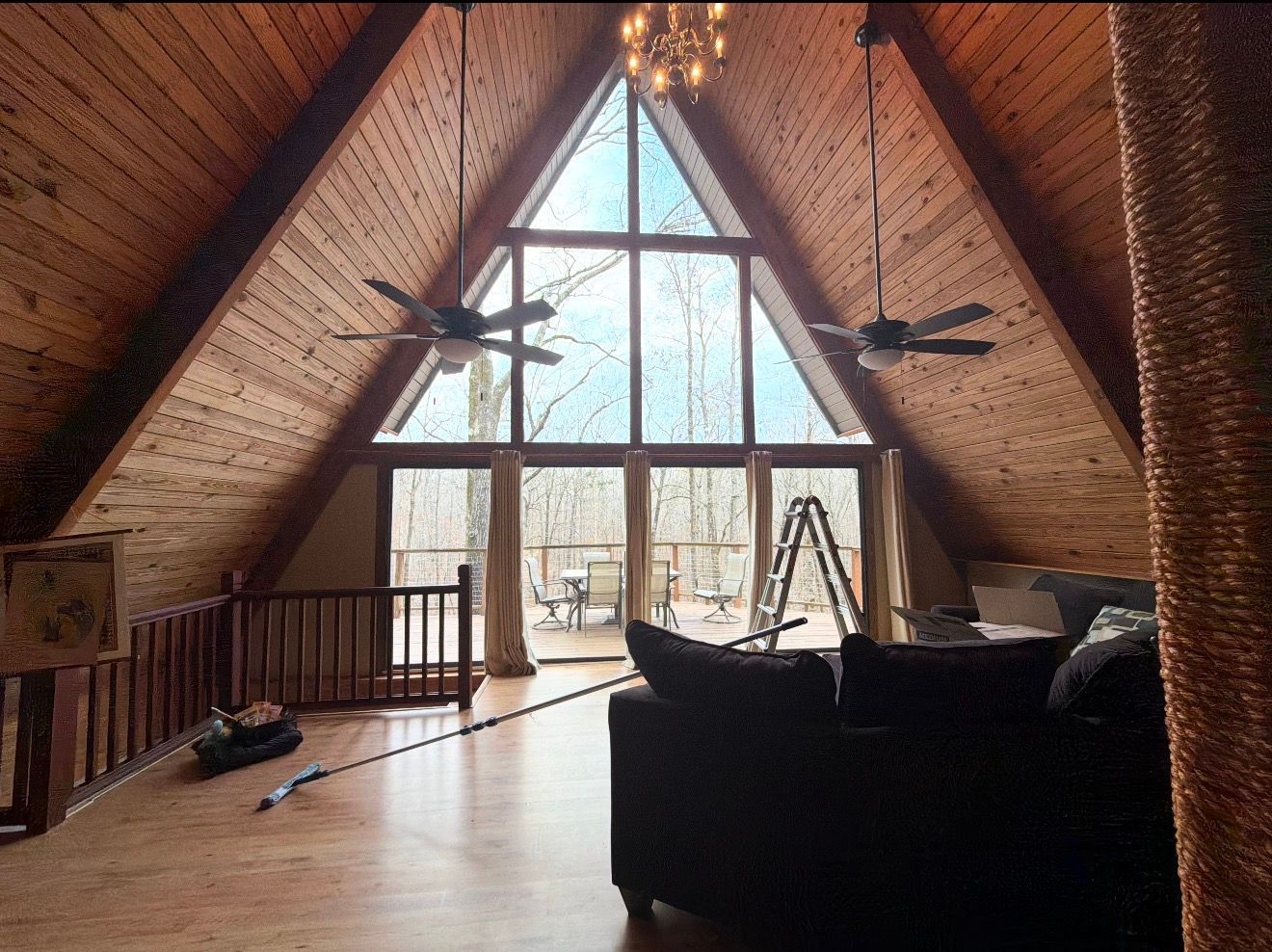 An empty room with a toilet and a window