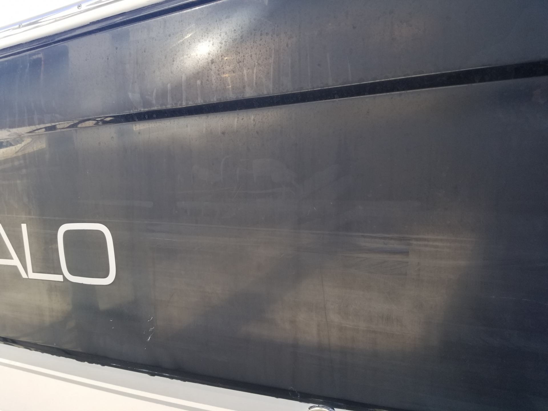 A close up of oxidation on the side of a boat.