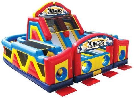 An inflatable obstacle course with the word ultimate on it