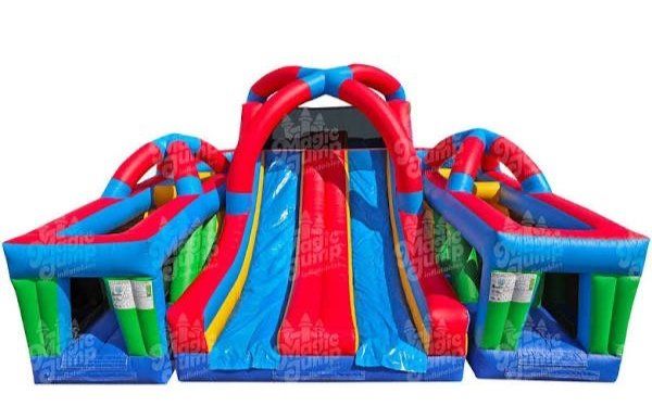 A large inflatable obstacle course with a red , blue and green slide.