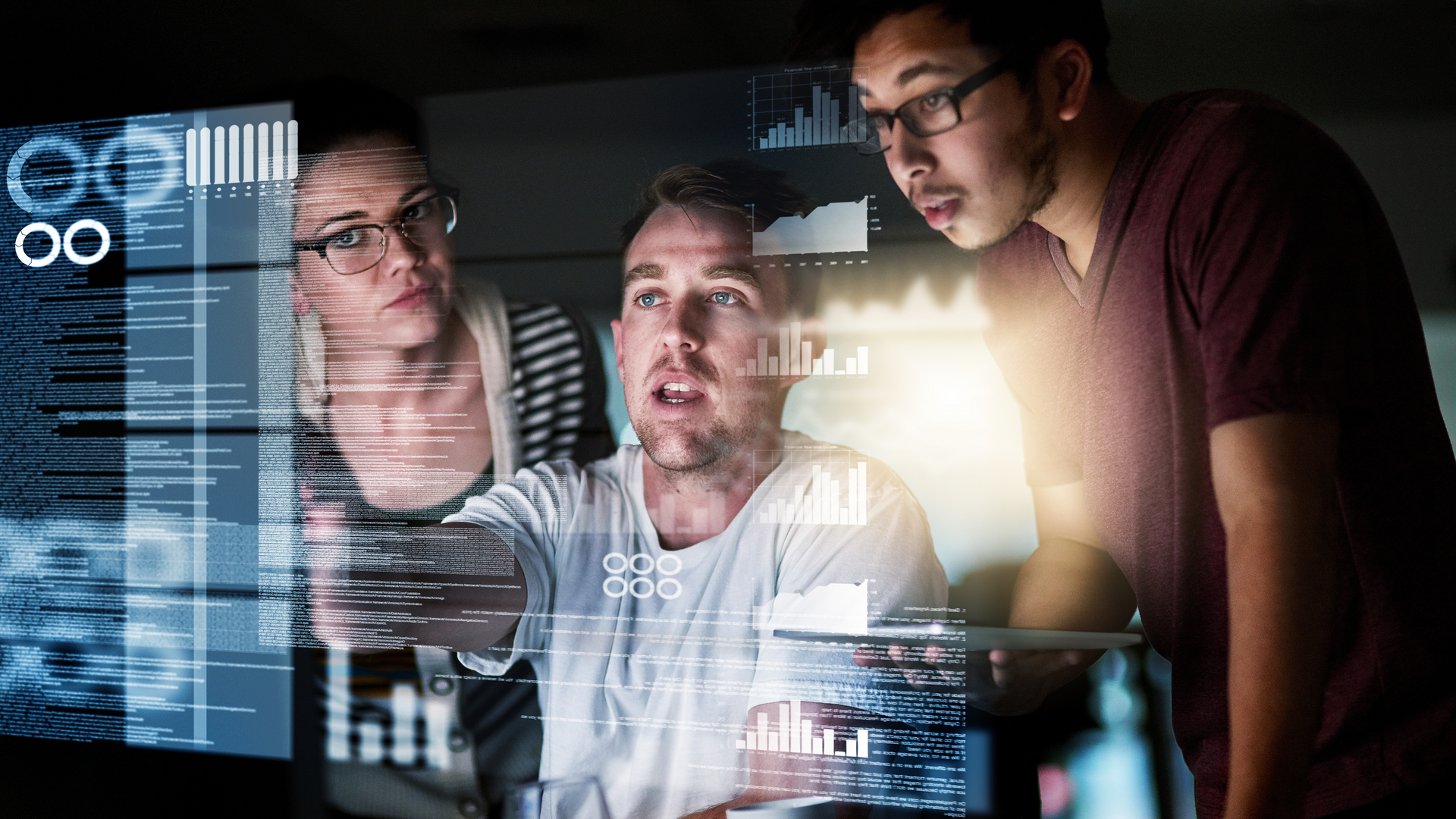 A group of people are looking at a computer screen.