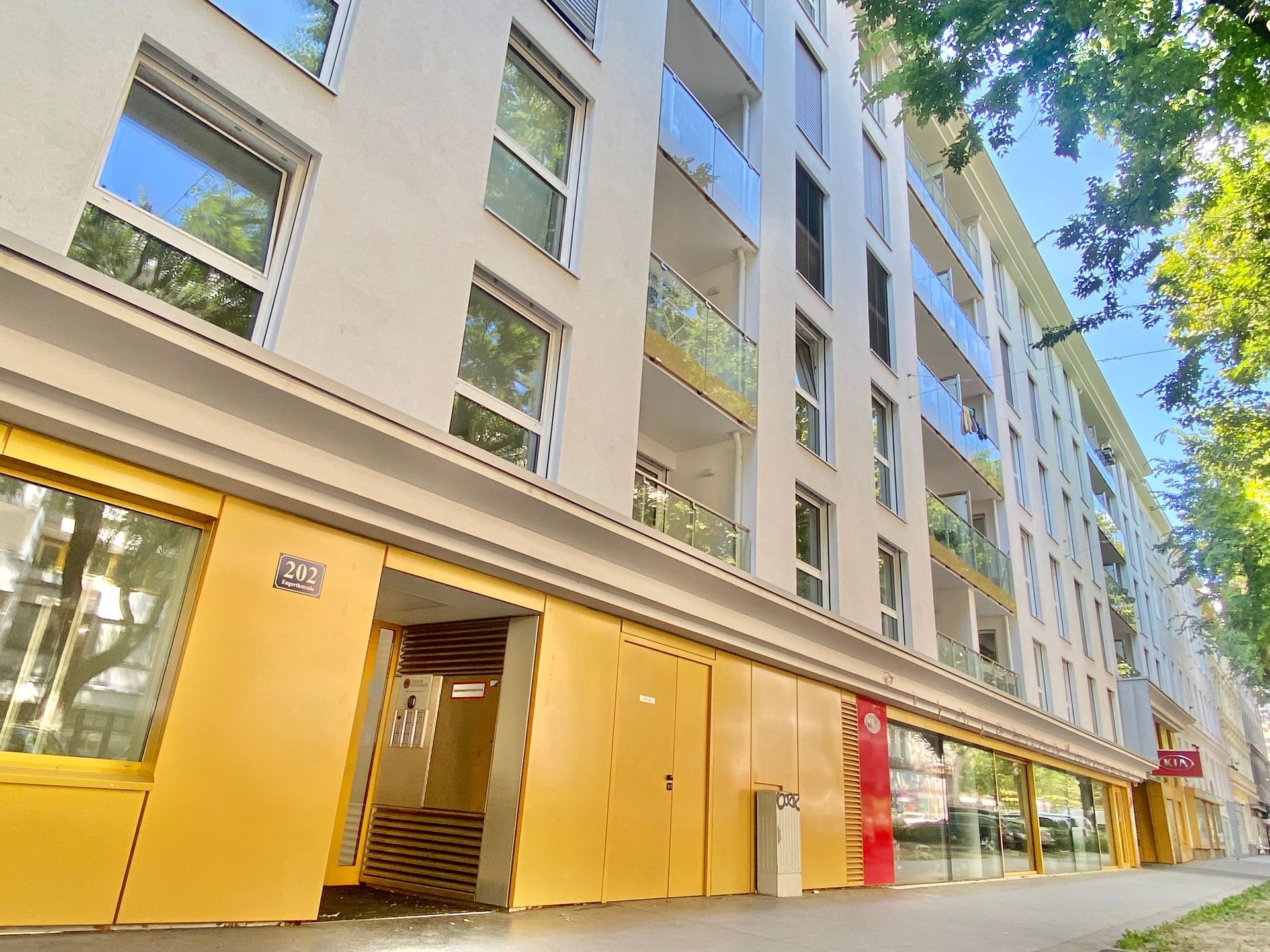 A large building with a lot of windows and a yellow door