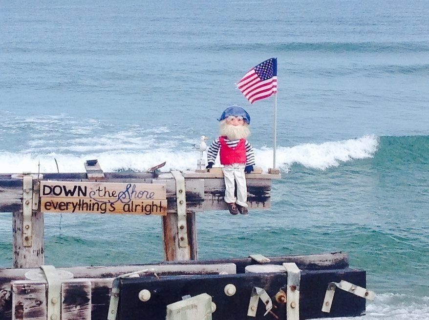 A sign that says down at the bottom everything's alright