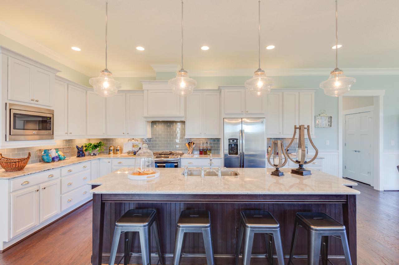 Elegant kitchen brown island with stools | Kitchen Gallery | Stephen Alexander Homes | Chesapeake, VA