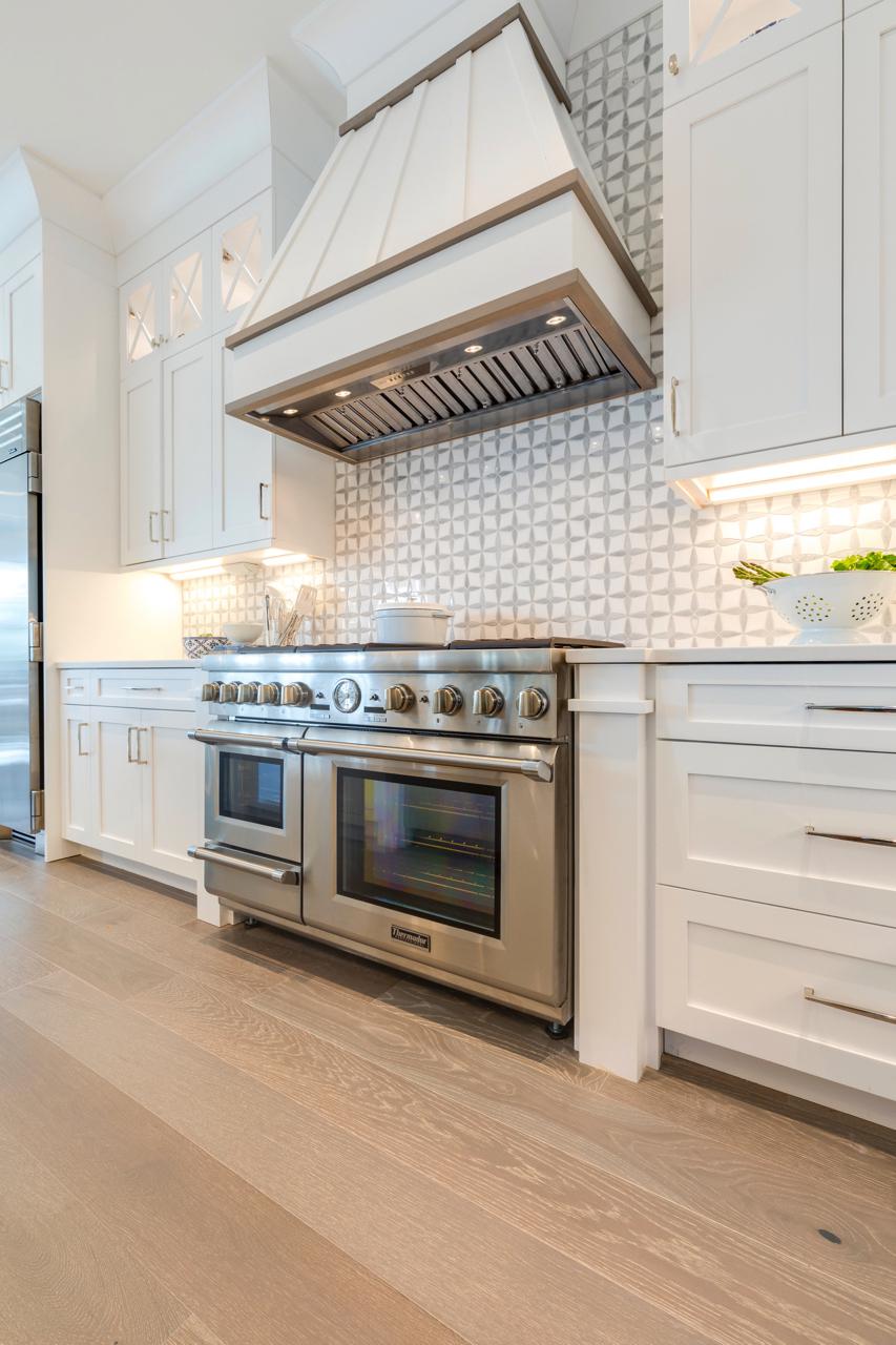 Elegant kitchen stove with white cabinets | Kitchen Gallery | Stephen Alexander Homes | Chesapeake, VA