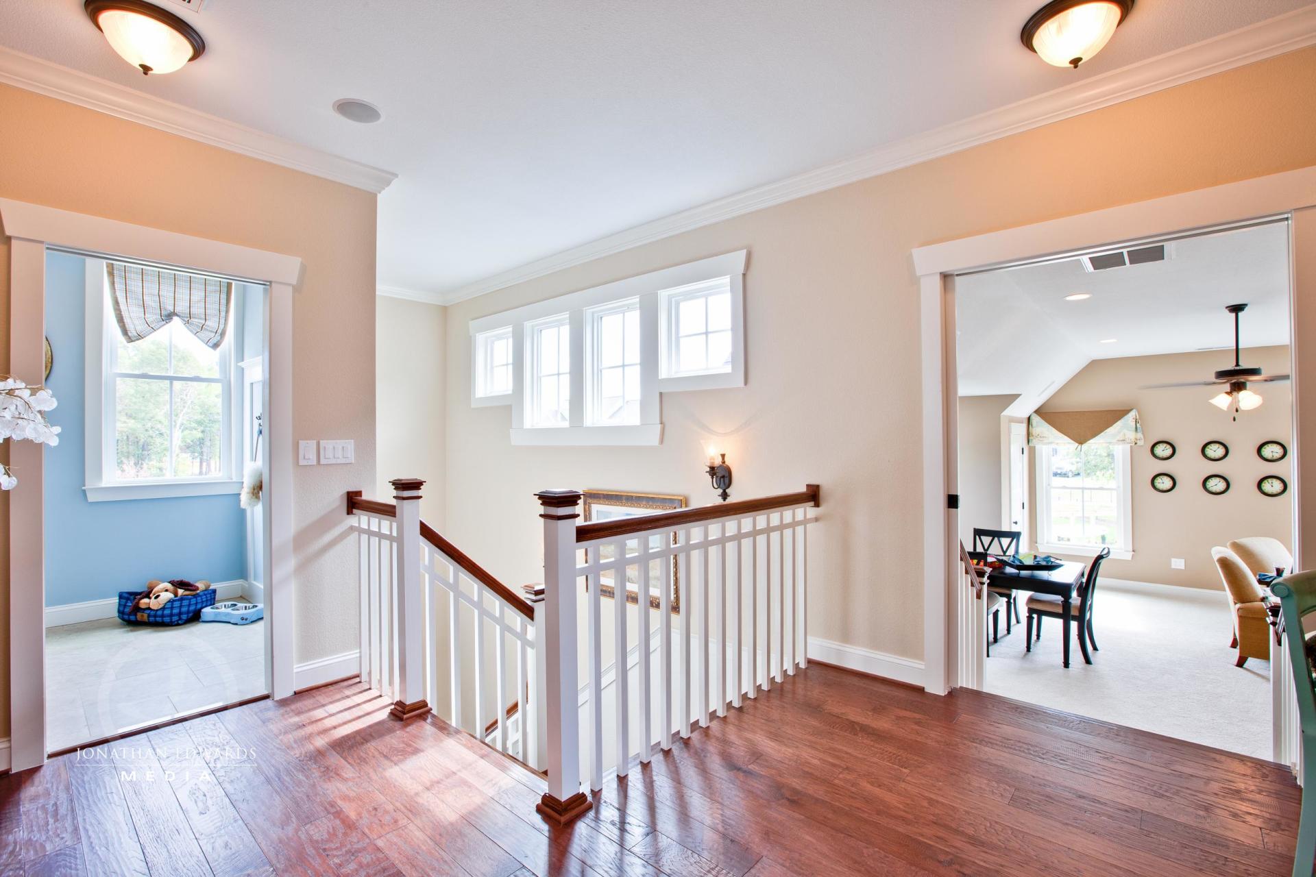 Elegant hallway view from second floor | Living Spaces Gallery | Stephen Alexander Homes | Chesapeake, VA