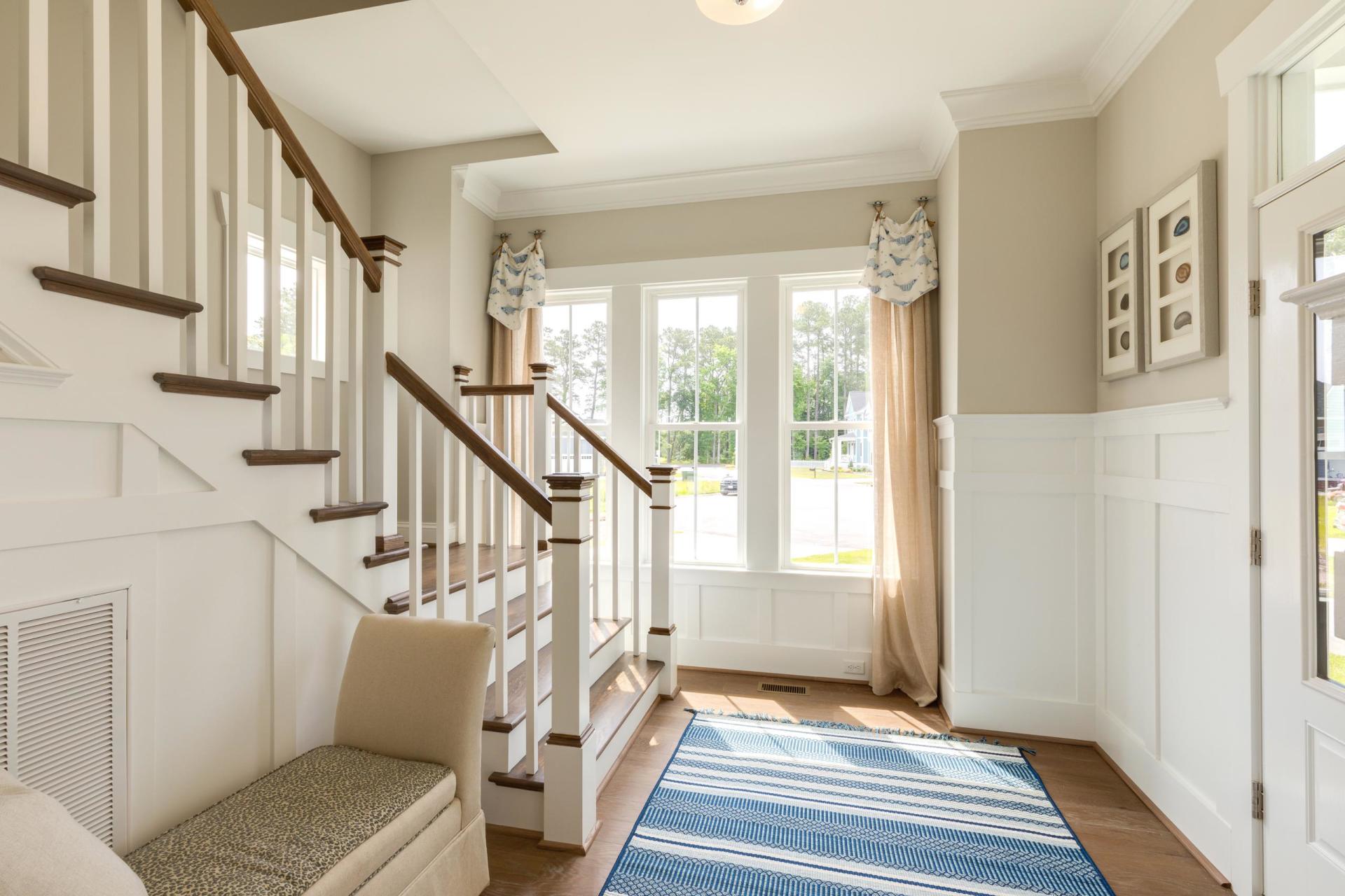 Elegant front entry area with staircase view  | Living Spaces Gallery | Stephen Alexander Homes | Chesapeake, VA