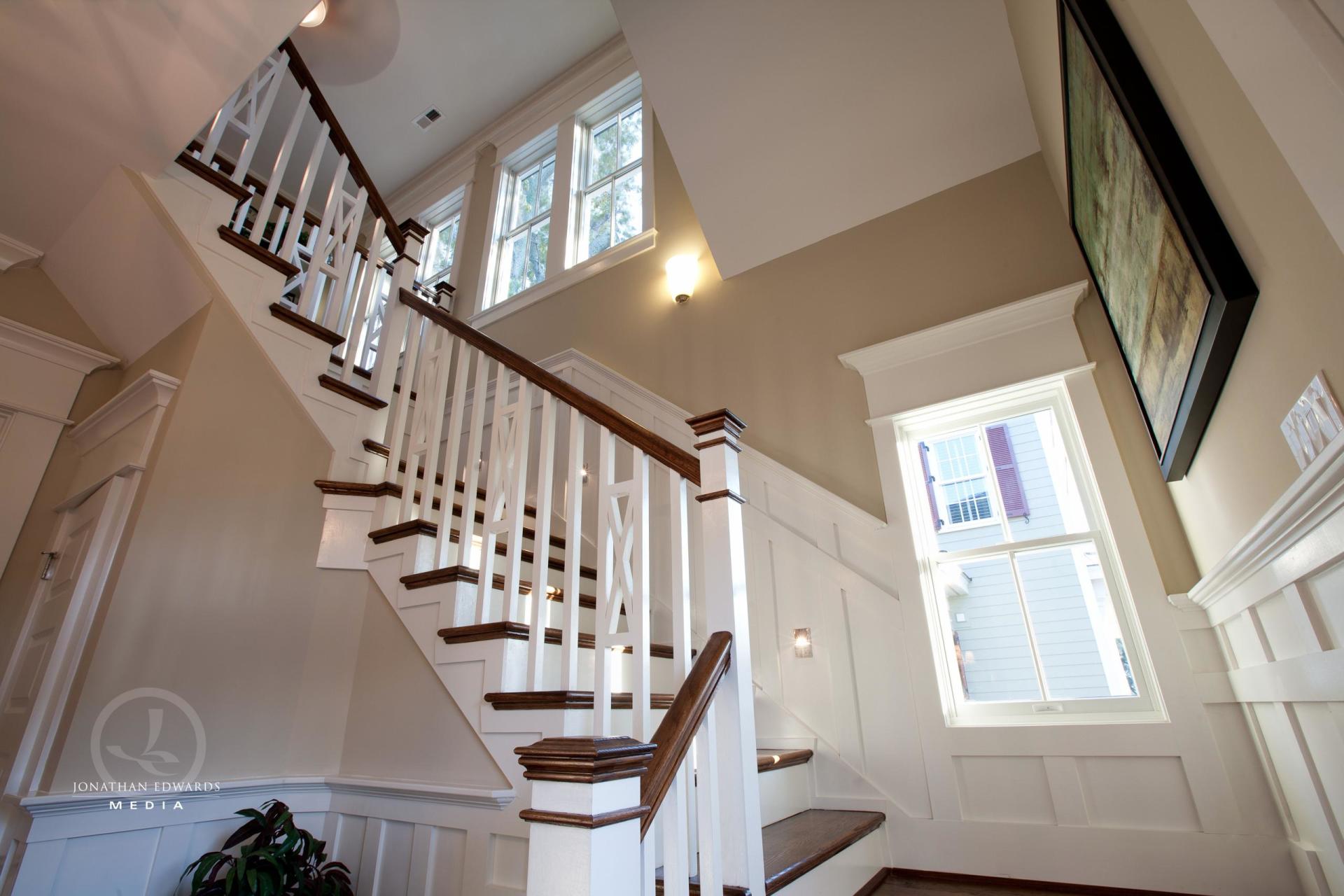 View of elegant staircase from first floor  | Living Spaces Gallery | Stephen Alexander Homes | Chesapeake, VA