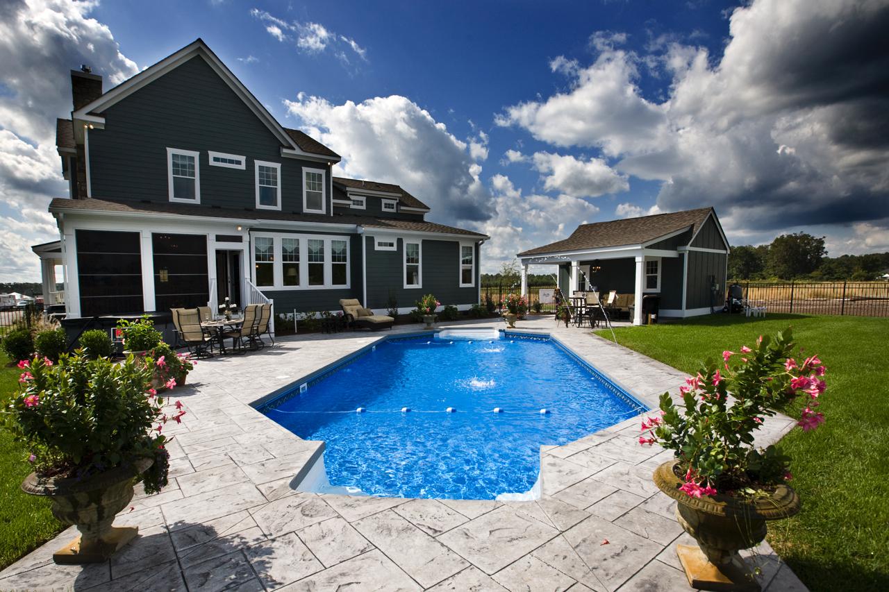 Elegant back yard of green home with pool  | Exterior Gallery | Stephen Alexander Homes | Chesapeake, VA
