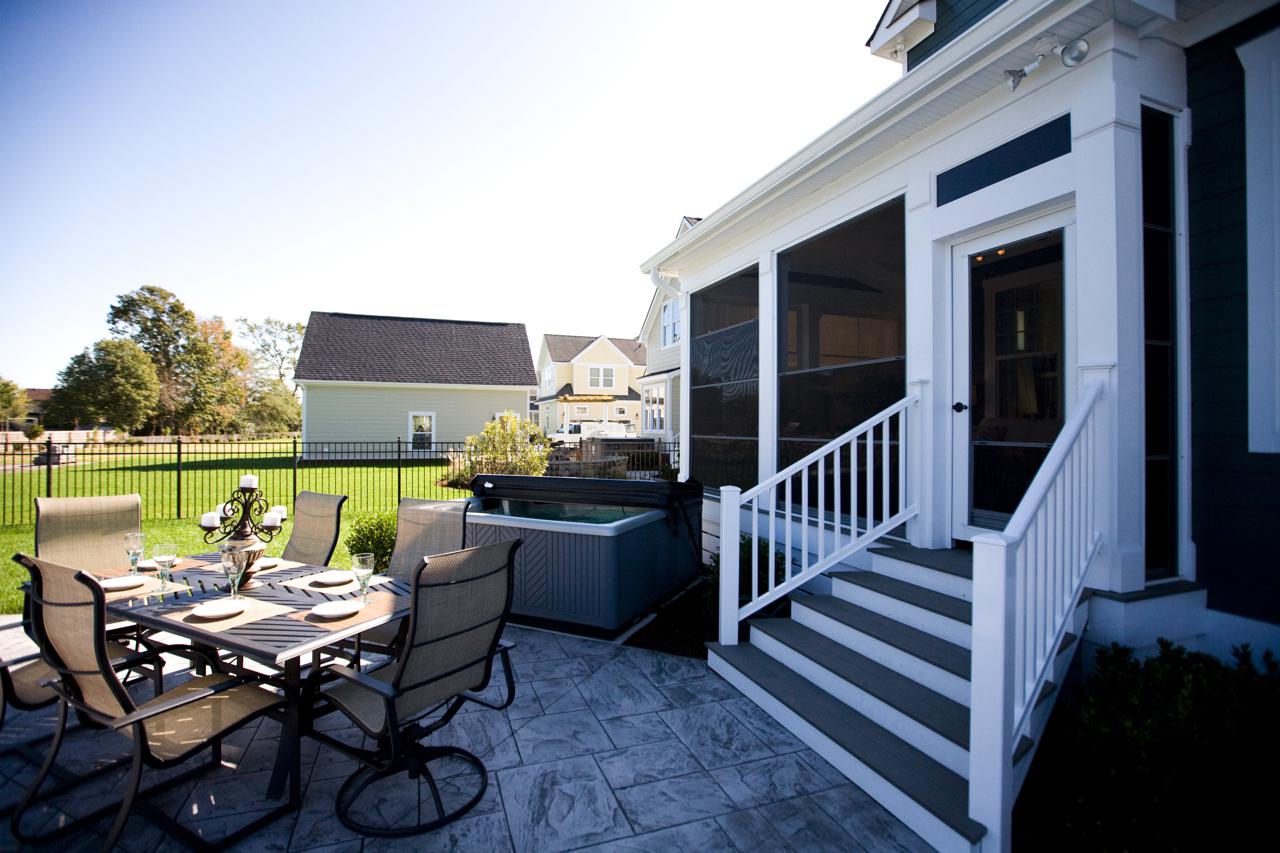 Elegant outdoor seating area with a grill  | Exterior Gallery | Stephen Alexander Homes | Chesapeake, VA