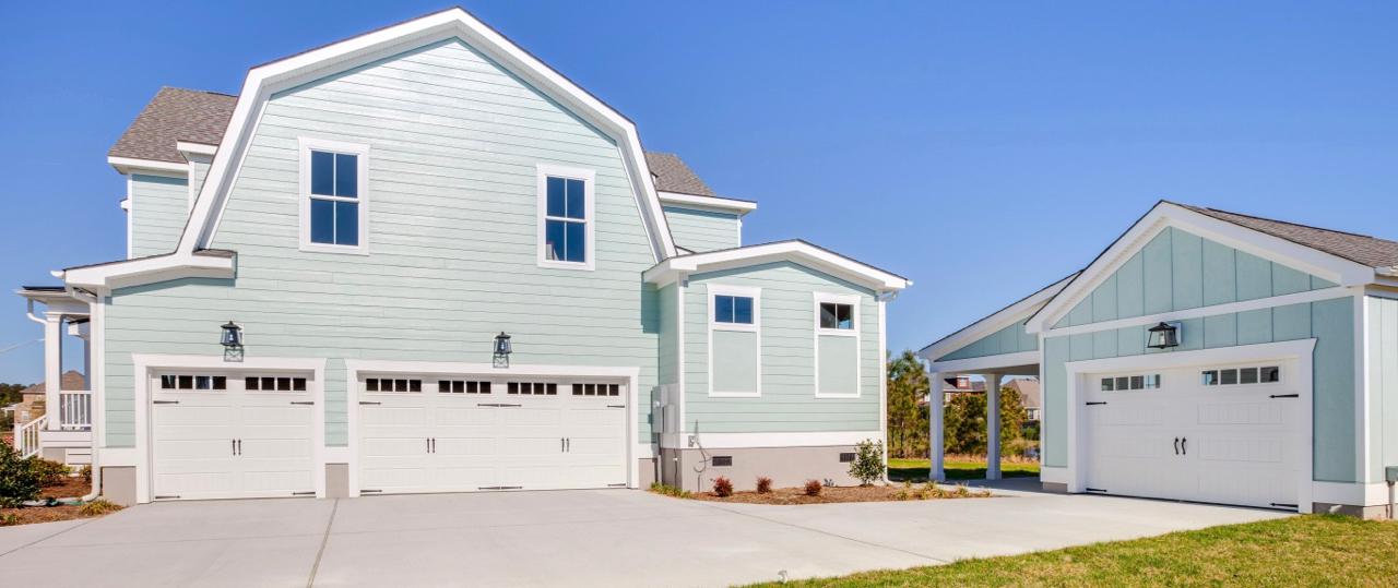 Elegant rear exterior of teal home showing garage  | Exterior Gallery | Stephen Alexander Homes | Chesapeake, VA
