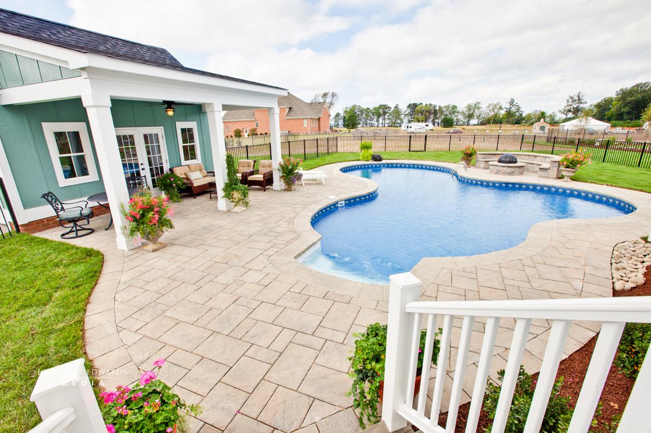 Elegant exterior of green home with pool  | Exterior Gallery | Stephen Alexander Homes | Chesapeake, VA