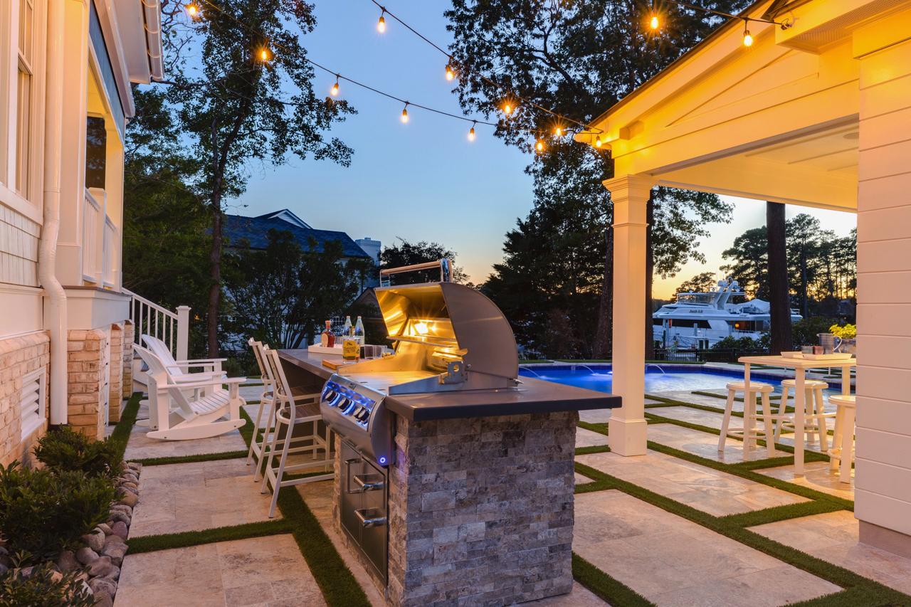 Elegant rear exterior with view of seating area and grill | Exterior Gallery | Stephen Alexander Homes | Chesapeake, VA