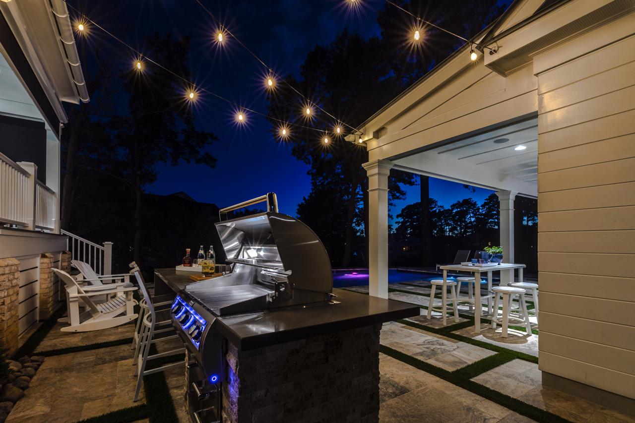 Elegant rear exterior with view of seating area and grill | Exterior Gallery | Stephen Alexander Homes | Chesapeake, VA